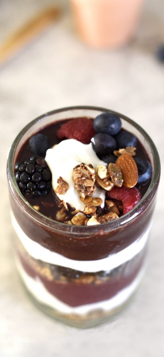 yogurt, raspberries, blueberries, blackberries, nuts, chocolate