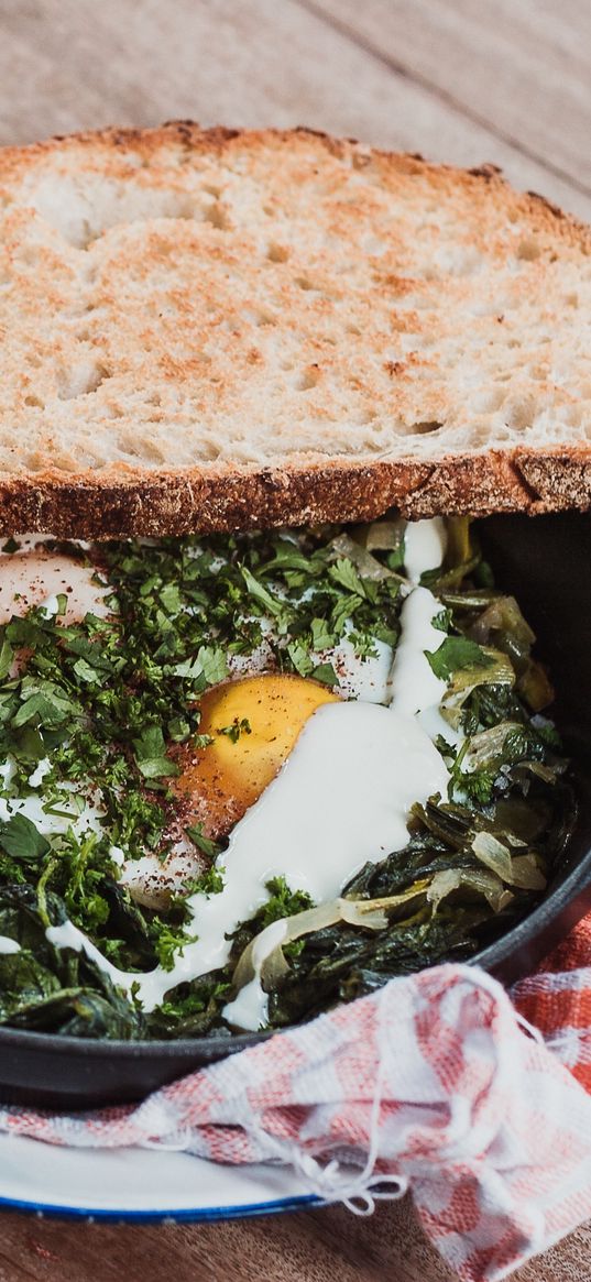 scrambled eggs, bread, vegetables