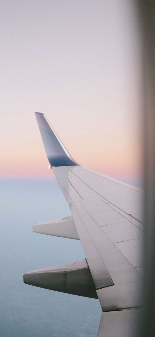 airplane wing, porthole, sky