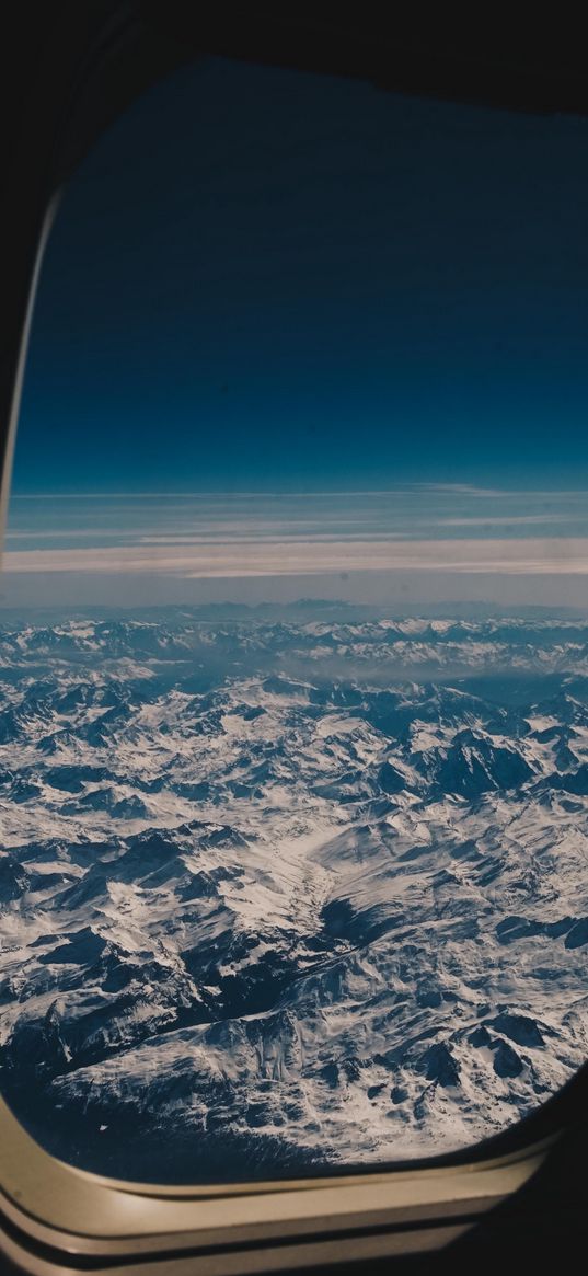 porthole, airplane, mountains