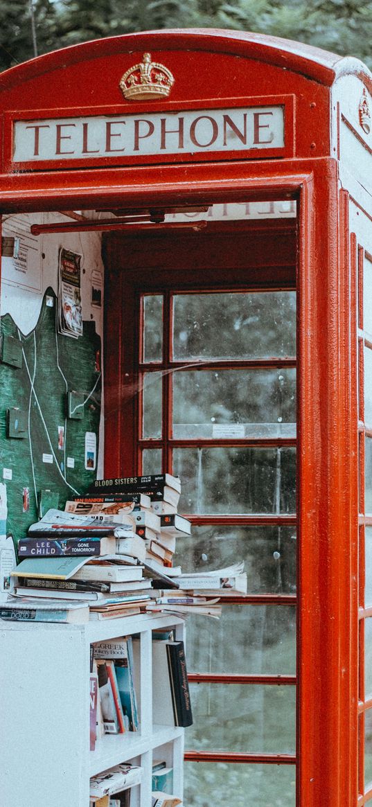 telephone booth, books, street