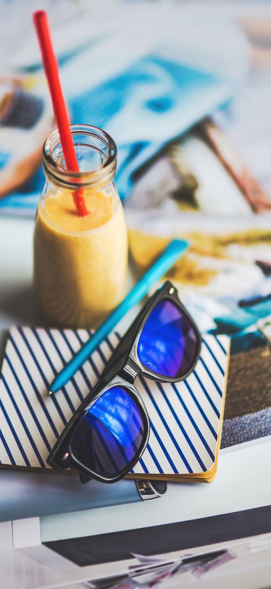 sunglasses, juice, notebook, pen