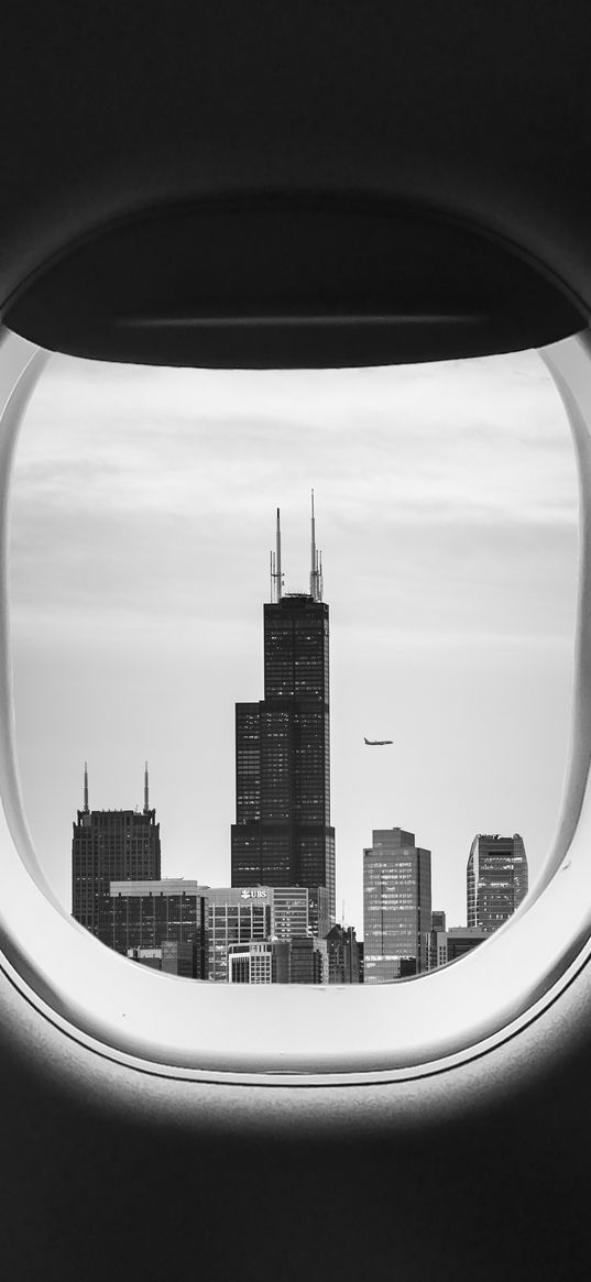 porthole, bw, airplane window, buildings, flight