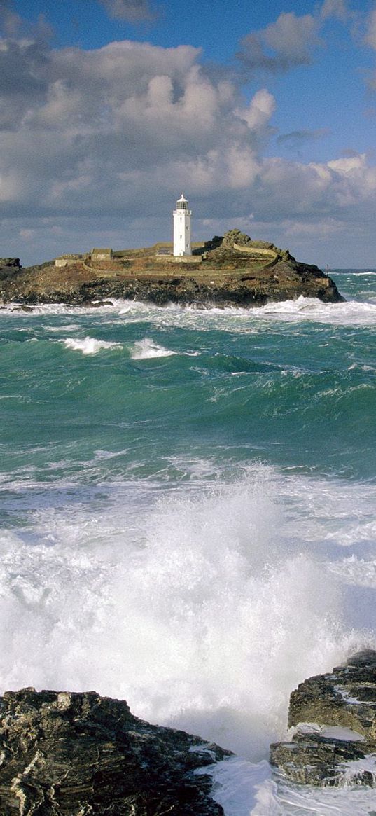 beacon, waves, stones, sky