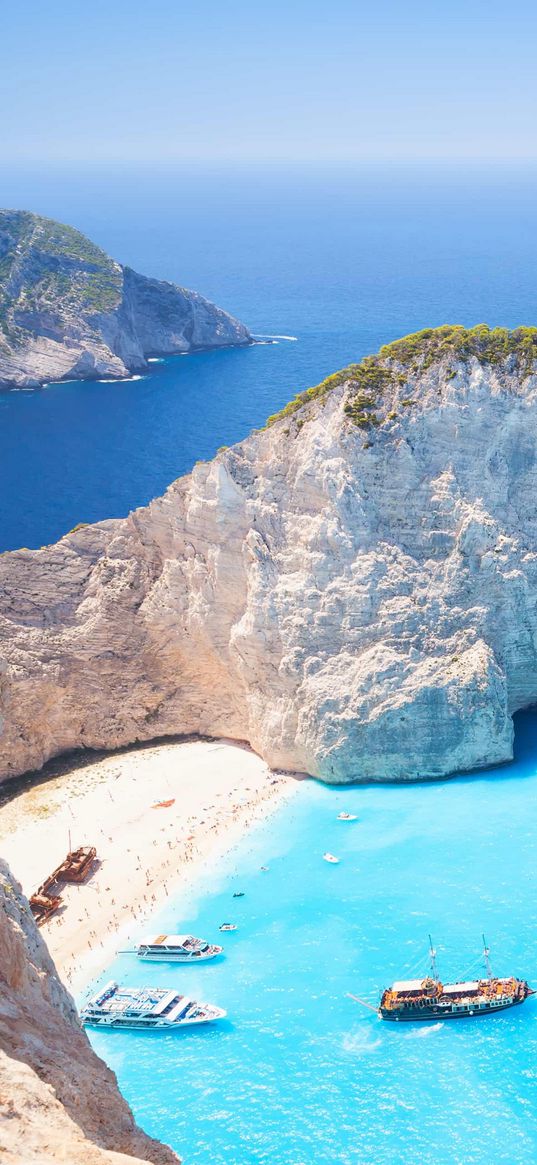 beach, sea, sand, sky, water, rocks, boats, shades of blue