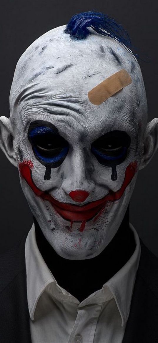 clown, dead silence, character, makeup, gray background, portrait