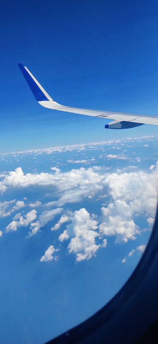 blue sky, airplane, window view, clouds, wing