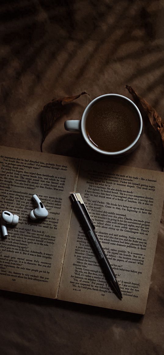 coffee, book, airpods, headphones, pen, leaves, brown