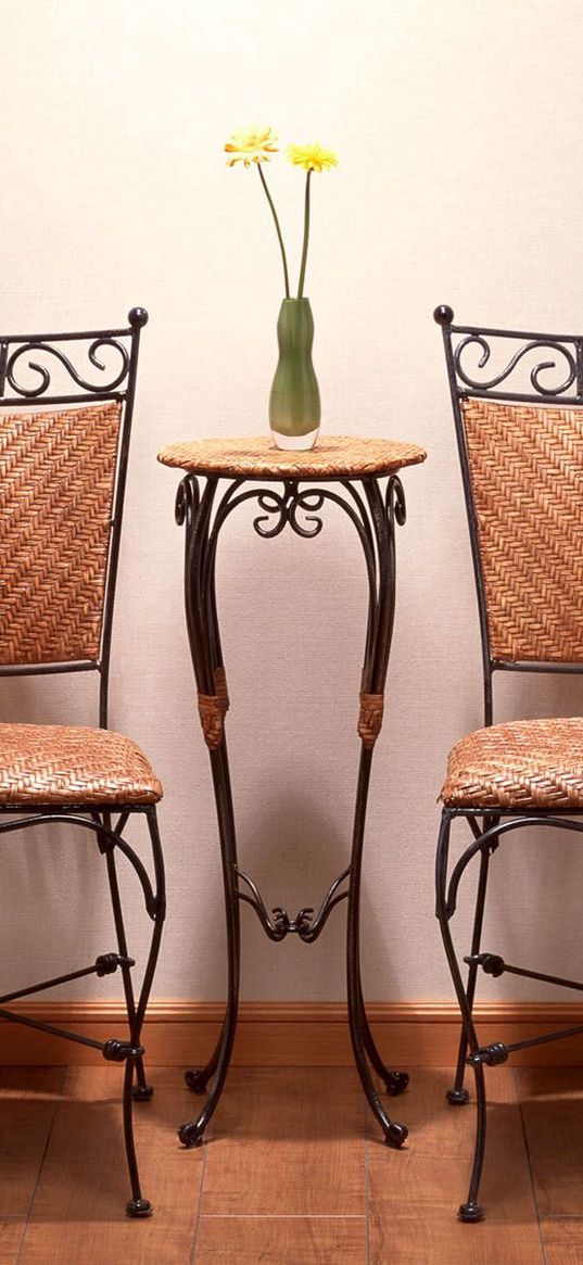 table, vase, chairs, walls, light