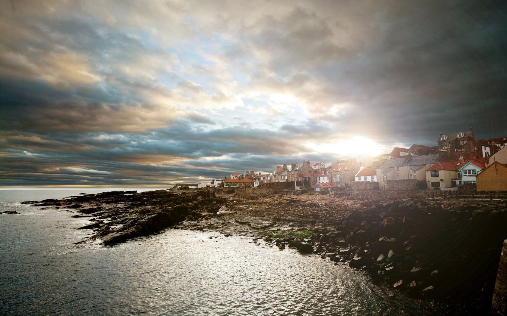 city, coast, stones, sun, light, sea, at home, clouds, cloudy