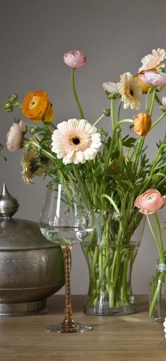 gerbera, ranunkulyus, flowers, glasses, candles, vases, decoration