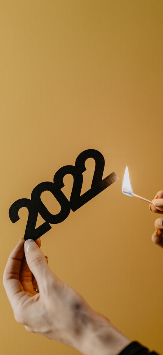 2022, numbers, match, fire, hands, yellow background, new year, christmas, holiday