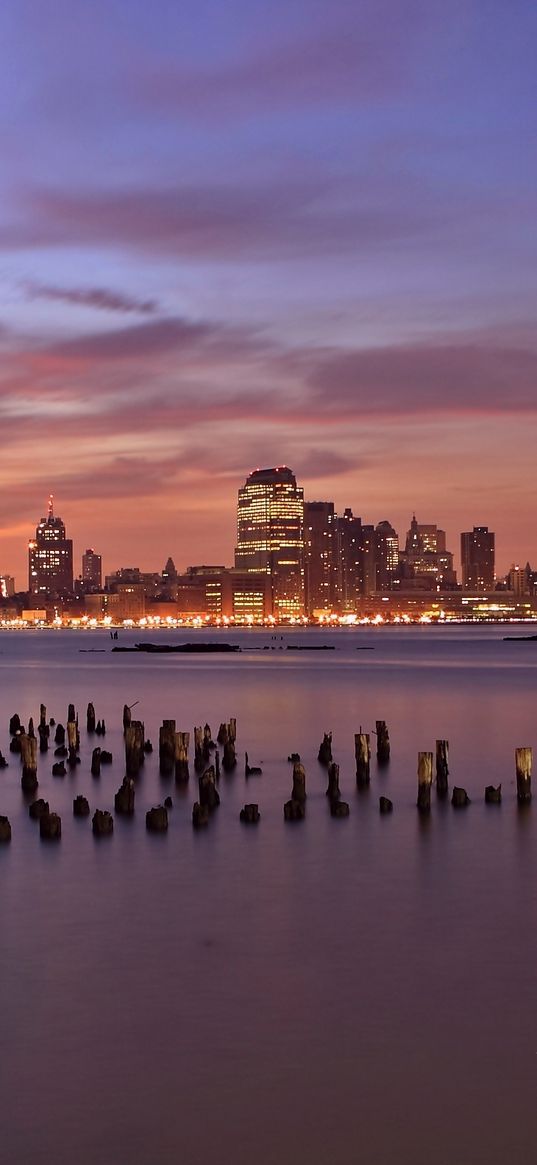 usa, jersey city, new jersey, evening, orange, sunset, purple, sky, skyscrapers, lights, river, hudson, wooden, poles