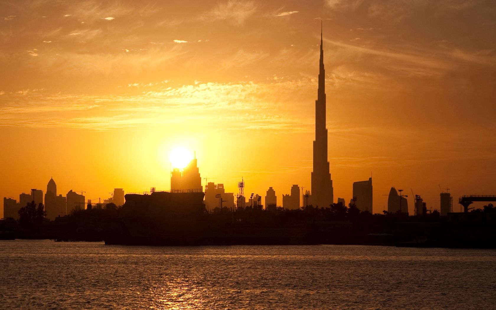 dubai, buildings, houses, silhouette, sunset, distance, sky, clouds, tower, water, stroking