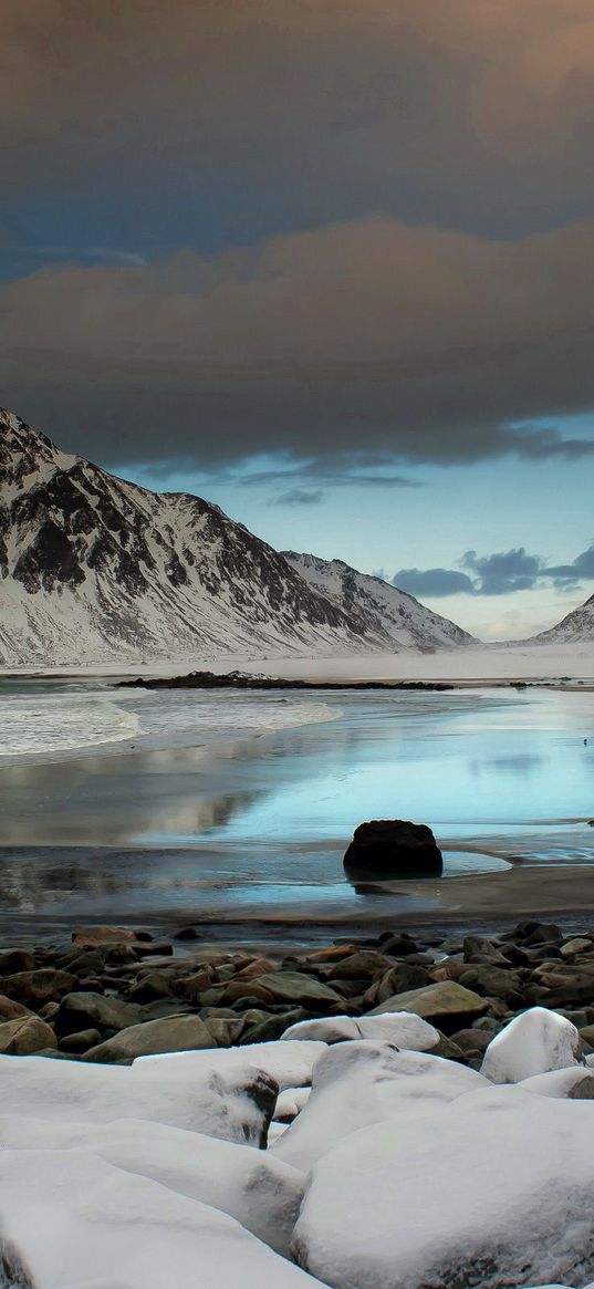 ocean, coast, stones, cold, snow, mountains, clouds, sky, gloomy, seagull, bird