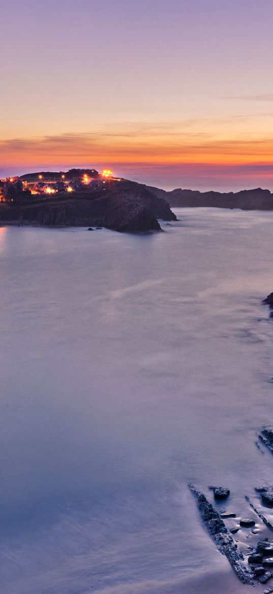 rocks, moon, sea, sky, decline, coast, city, fires, twilight, pebble