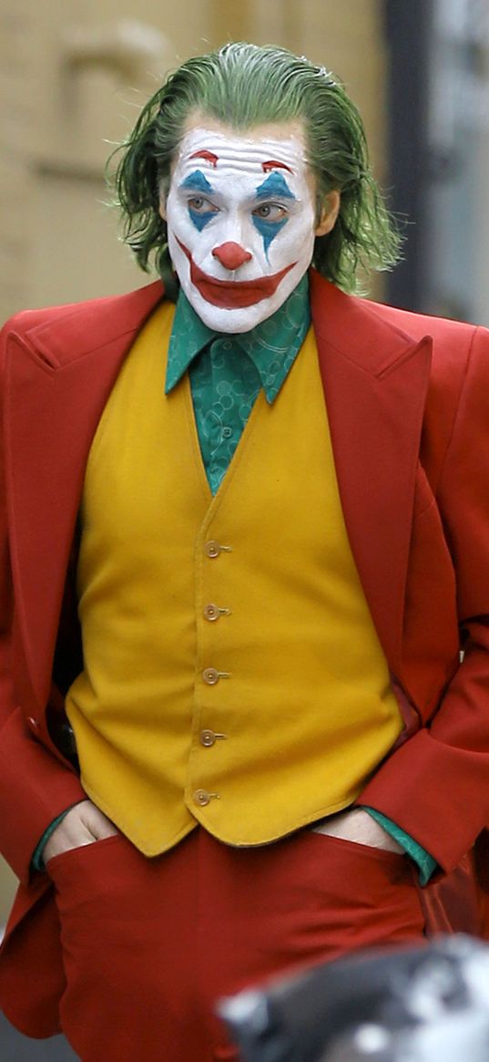 joaquin phoenix, actor, joker, movie, clown, tuxedo, street