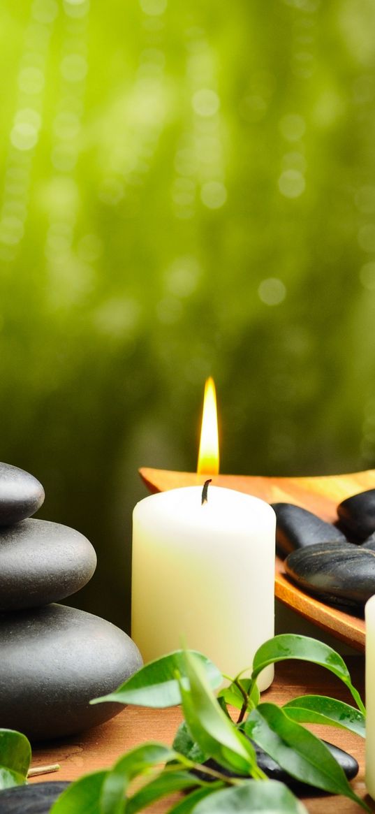 orchid, stones, candles, towels