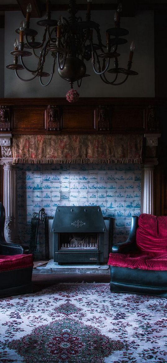 lounge, chairs, fireplace, chandelier, floor