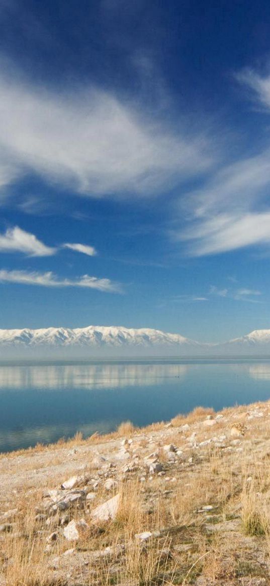 stones, coast, grass, sky, clouds, mountains, lake, day