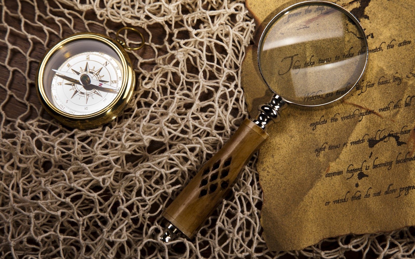 net, magnifying glass, compass, string, paper