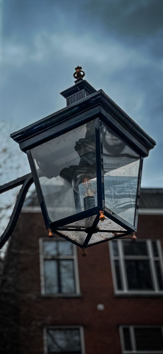 lantern, light bulb, wall, house, building, sky, architecture