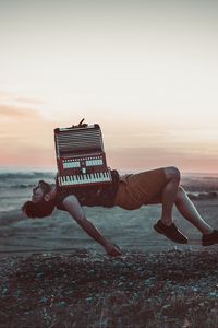 Preview wallpaper accordion, levitation, musician, flight, musical instrument