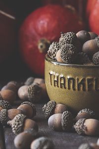 Preview wallpaper acorns, bowl, fruit, brown