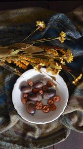 Preview wallpaper acorns, plate, flowers, cloth