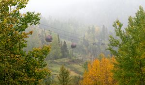 Preview wallpaper aerial lift, trees, autumn, fog, nature