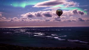 Preview wallpaper air balloon, ocean, aurora borealis, coast, clouds