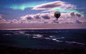 Preview wallpaper air balloon, ocean, aurora borealis, coast, clouds