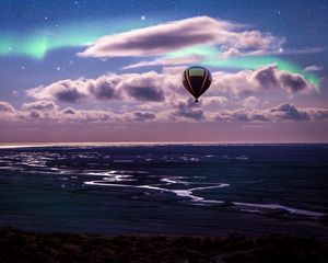 Preview wallpaper air balloon, ocean, aurora borealis, coast, clouds
