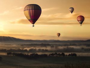 Preview wallpaper air balloons, field, fog, sky, sunset