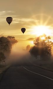 Preview wallpaper air balloons, road, fog, sunlight, sunset