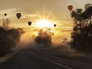 Preview wallpaper air balloons, road, fog, sunlight, sunset