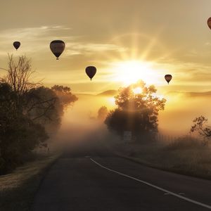 Preview wallpaper air balloons, road, fog, sunlight, sunset