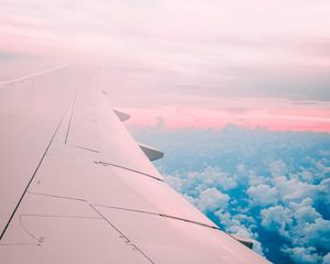 Preview wallpaper aircraft wing, clouds, flight, sky, porous