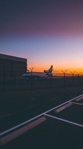 Preview wallpaper airplane, airport, runway, sunset