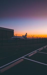 Preview wallpaper airplane, airport, runway, sunset