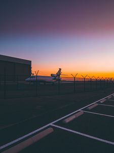 Preview wallpaper airplane, airport, runway, sunset