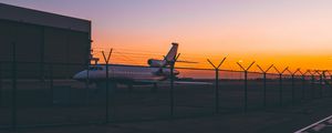 Preview wallpaper airplane, airport, runway, sunset