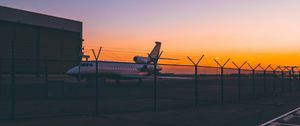 Preview wallpaper airplane, airport, runway, sunset