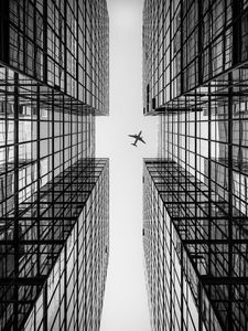 Preview wallpaper airplane, building, facade, bw, bottom view, hong kong