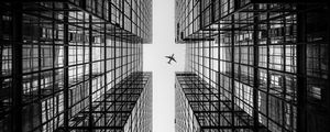 Preview wallpaper airplane, building, facade, bw, bottom view, hong kong