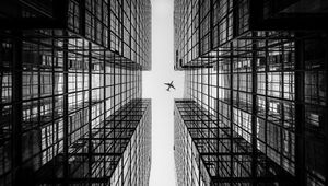 Preview wallpaper airplane, building, facade, bw, bottom view, hong kong