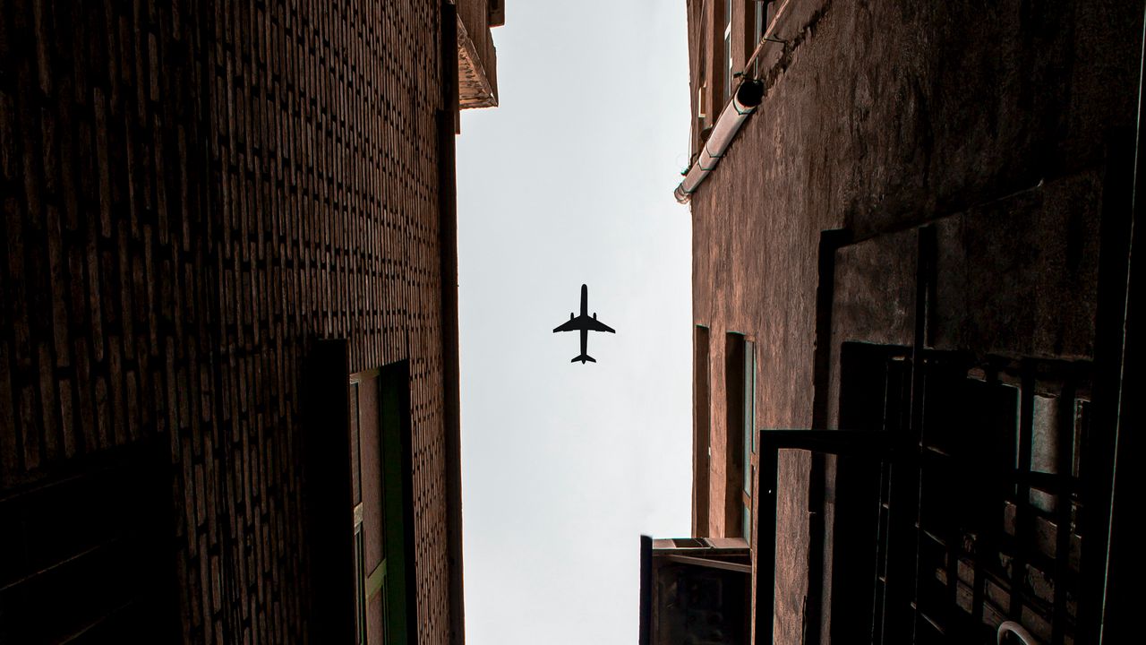 Wallpaper airplane, buildings, bottom view, flight
