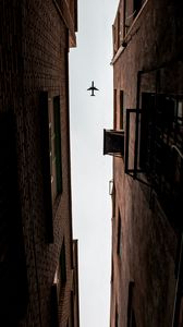 Preview wallpaper airplane, buildings, bottom view, flight