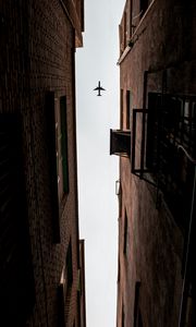 Preview wallpaper airplane, buildings, bottom view, flight