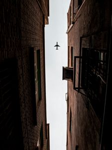 Preview wallpaper airplane, buildings, bottom view, flight